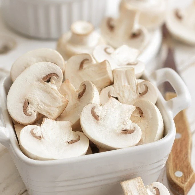 Freshed sliced white mushroom in brine in drums