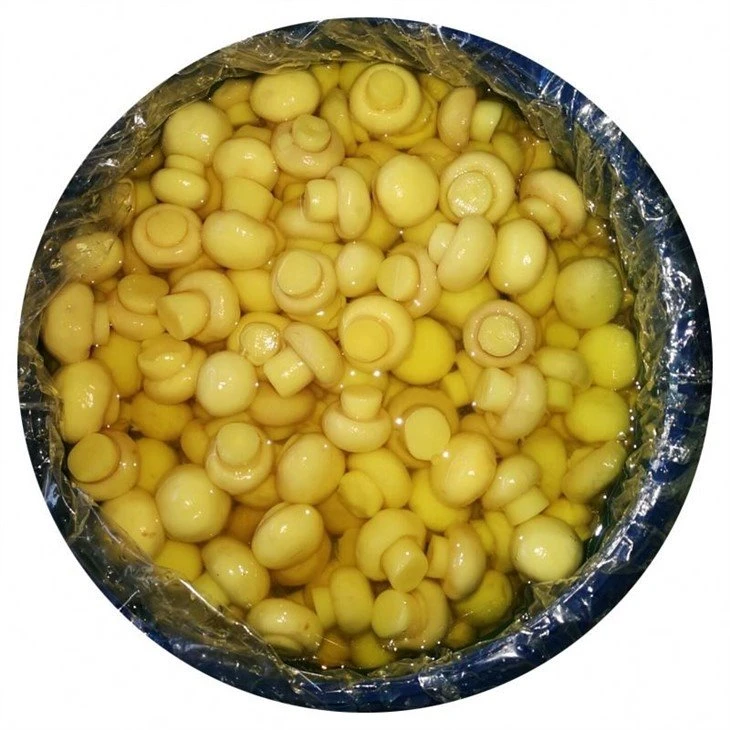 Whole white champignon in salted water in barrel
